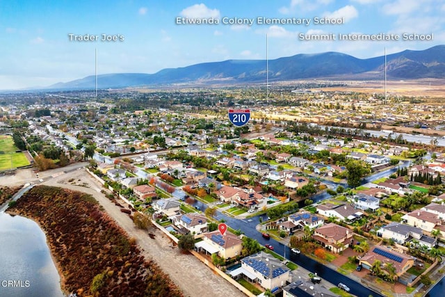 aerial view featuring a water and mountain view