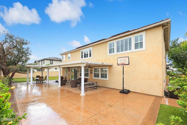 rear view of property with an outdoor hangout area and a patio area