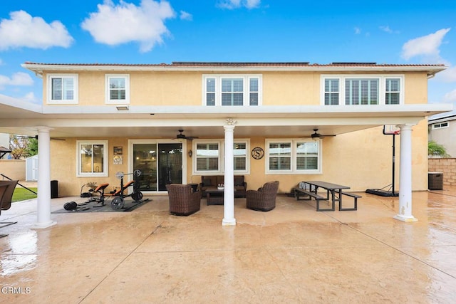 back of property featuring cooling unit, a patio, and ceiling fan