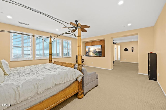 bedroom featuring light carpet and ceiling fan