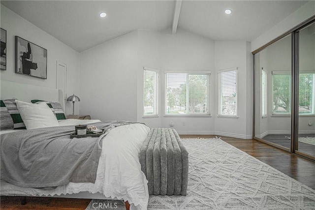 bedroom with wood-type flooring and lofted ceiling with beams