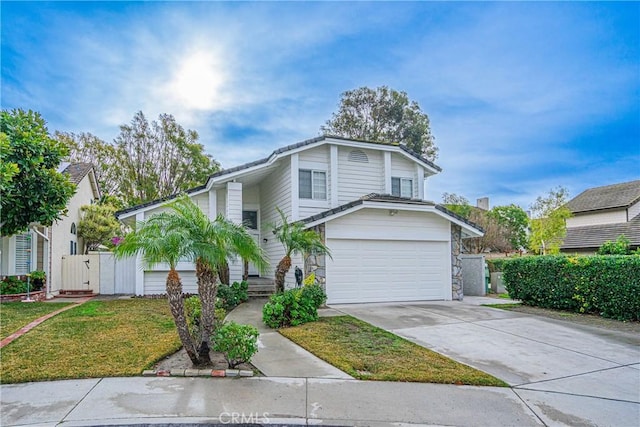 front of property with a garage and a front lawn