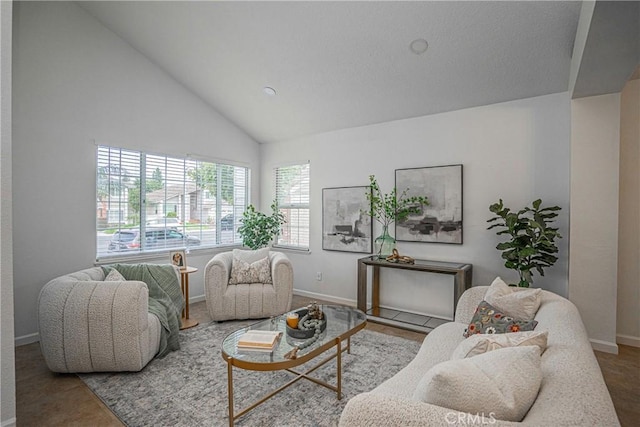 living room with high vaulted ceiling