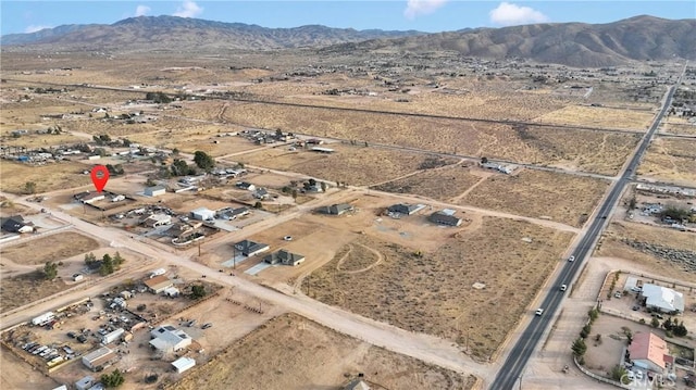 birds eye view of property featuring a mountain view