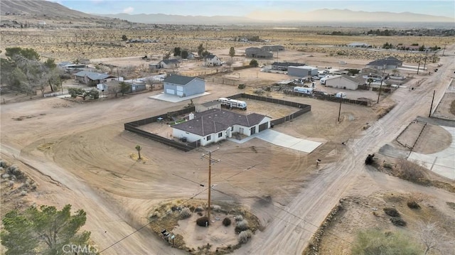 birds eye view of property featuring a mountain view