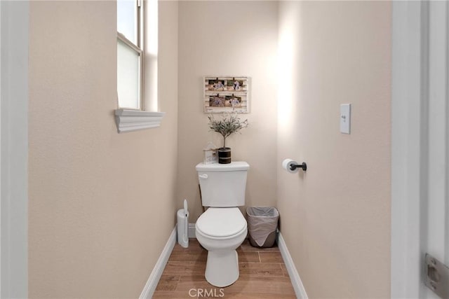 bathroom featuring toilet and hardwood / wood-style floors