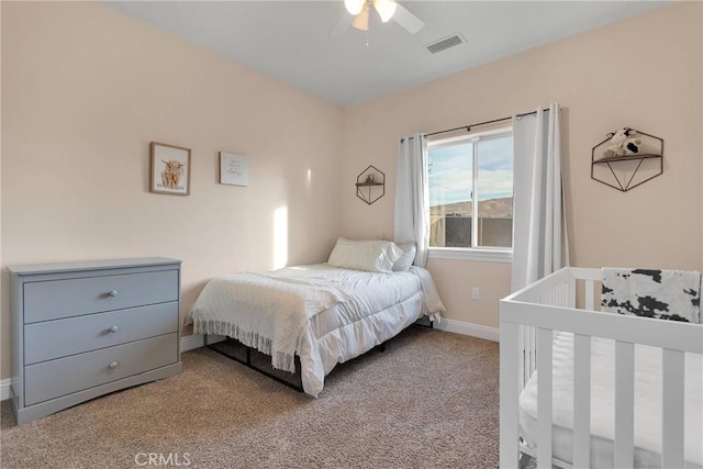 bedroom with light carpet and ceiling fan