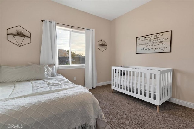 carpeted bedroom with lofted ceiling