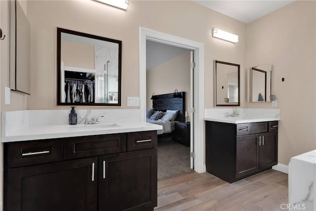 bathroom featuring hardwood / wood-style flooring and vanity