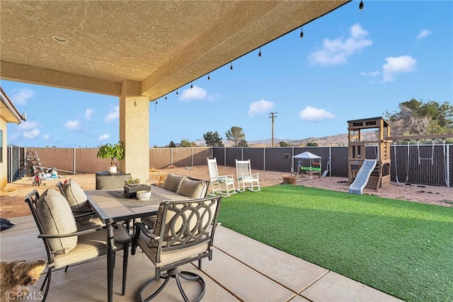 view of patio with a playground