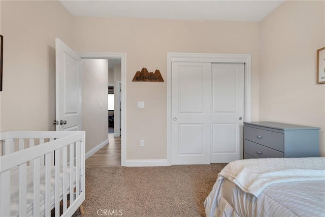 bedroom with carpet flooring and a closet