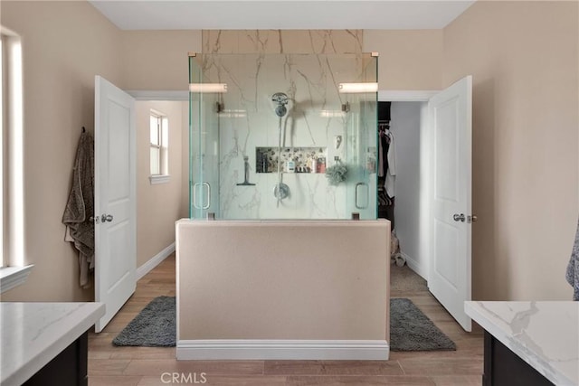 bathroom with vanity, hardwood / wood-style floors, and an enclosed shower