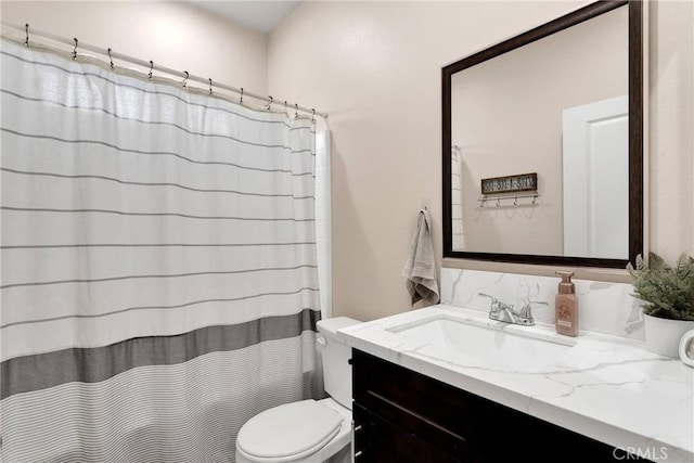 bathroom with walk in shower, vanity, and toilet