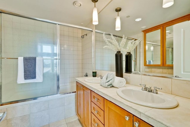 bathroom with vanity, tile patterned floors, and shower / bath combination with glass door