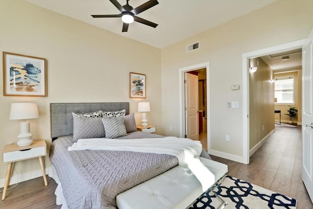 bedroom with hardwood / wood-style floors and ceiling fan