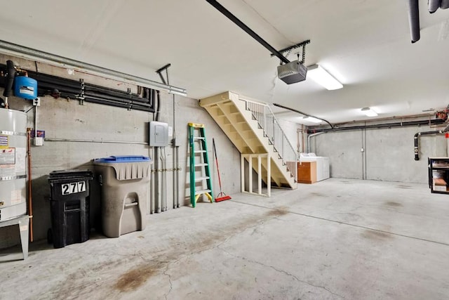 garage with a garage door opener and water heater