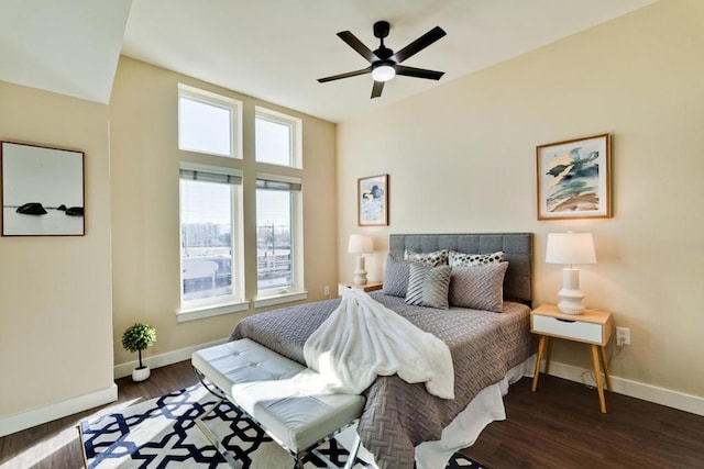 bedroom with ceiling fan and dark hardwood / wood-style flooring