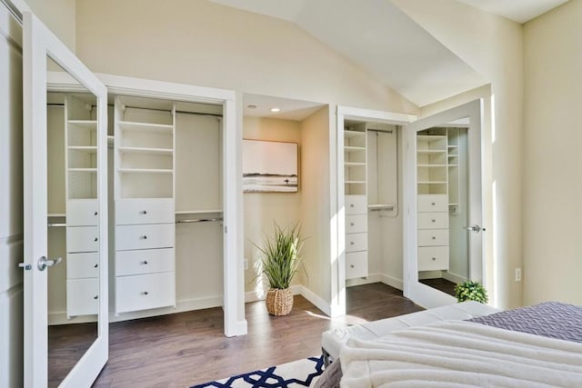 bedroom with lofted ceiling and dark hardwood / wood-style flooring