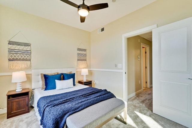 bedroom featuring ceiling fan and light carpet