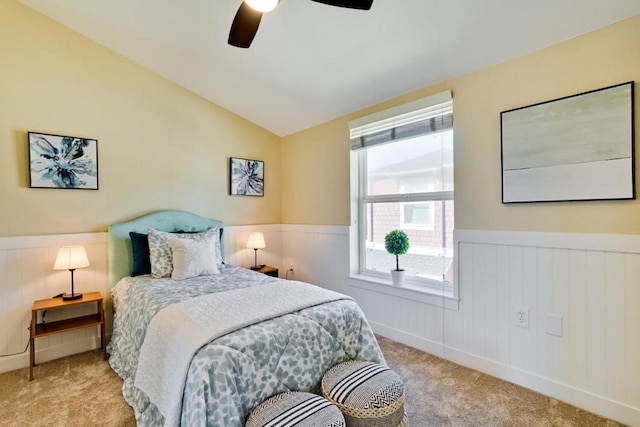 bedroom with lofted ceiling, light carpet, and ceiling fan