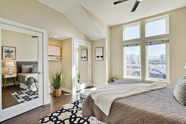 bedroom featuring lofted ceiling, dark wood-type flooring, and ceiling fan