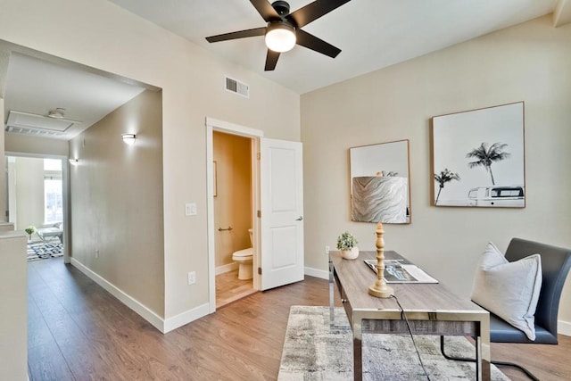 home office featuring hardwood / wood-style floors and ceiling fan