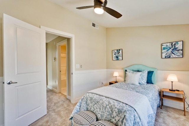 carpeted bedroom with vaulted ceiling and ceiling fan