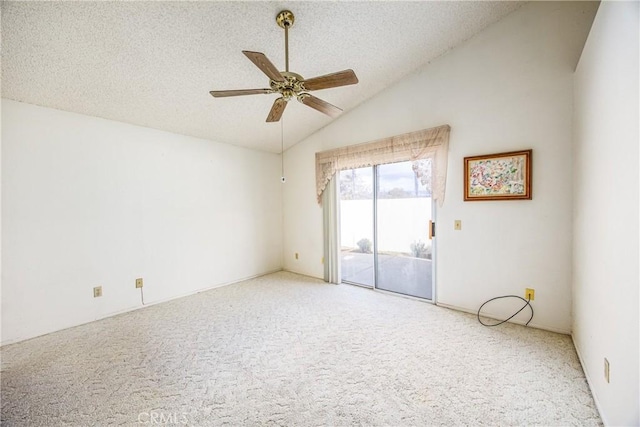 unfurnished room with lofted ceiling, a textured ceiling, a ceiling fan, and light colored carpet