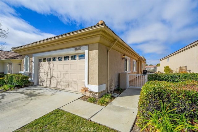 view of side of property featuring a garage