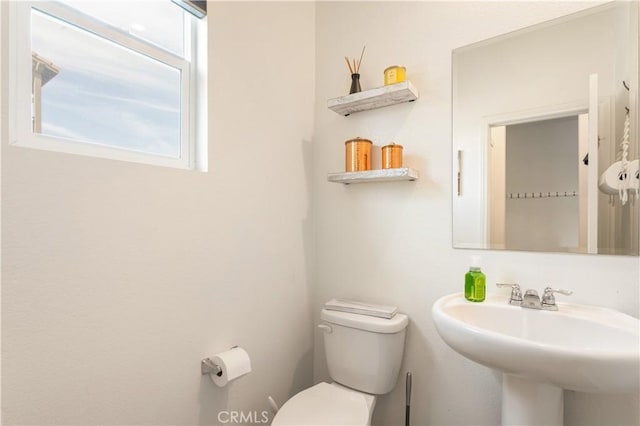 bathroom with sink and toilet