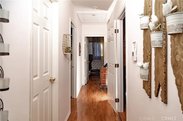 corridor featuring hardwood / wood-style floors