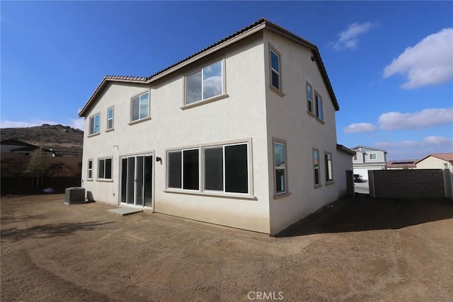 back of property with central air condition unit