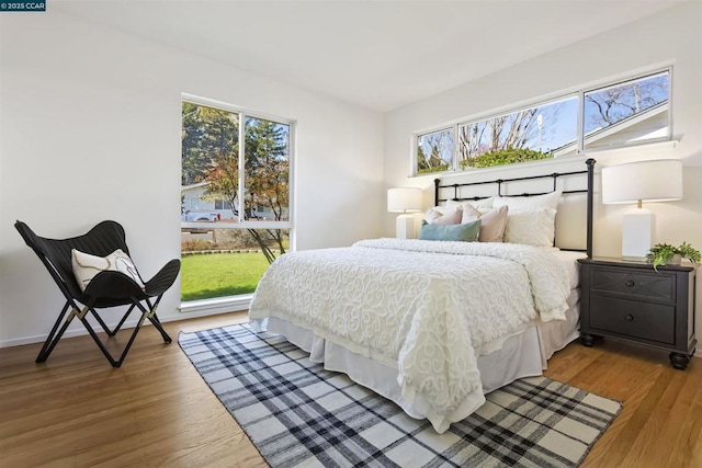 bedroom with hardwood / wood-style floors