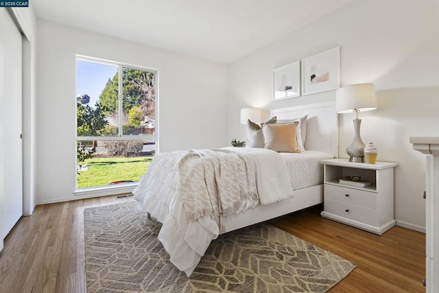 bedroom with hardwood / wood-style flooring