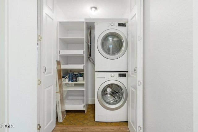 laundry room with stacked washer / dryer