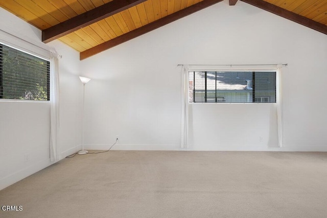 carpeted spare room with vaulted ceiling with beams and wooden ceiling