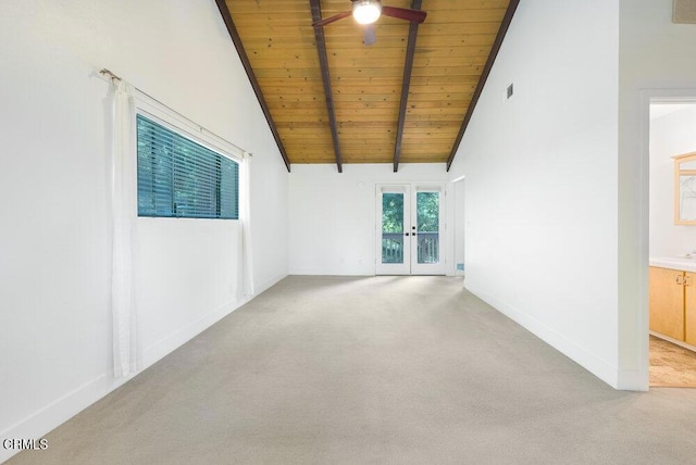 carpeted empty room featuring wood ceiling, beam ceiling, high vaulted ceiling, and ceiling fan