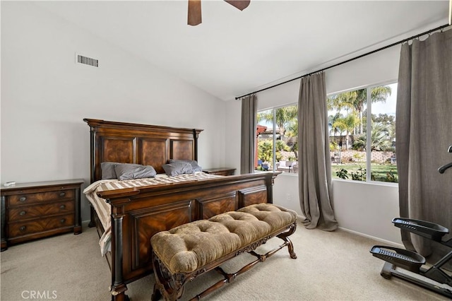 bedroom with visible vents, vaulted ceiling, a ceiling fan, and light colored carpet