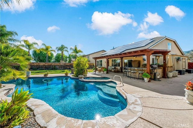 view of swimming pool with a patio area, a fenced backyard, outdoor dry bar, and a fenced in pool