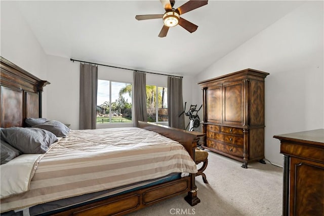 bedroom with light carpet, vaulted ceiling, and a ceiling fan