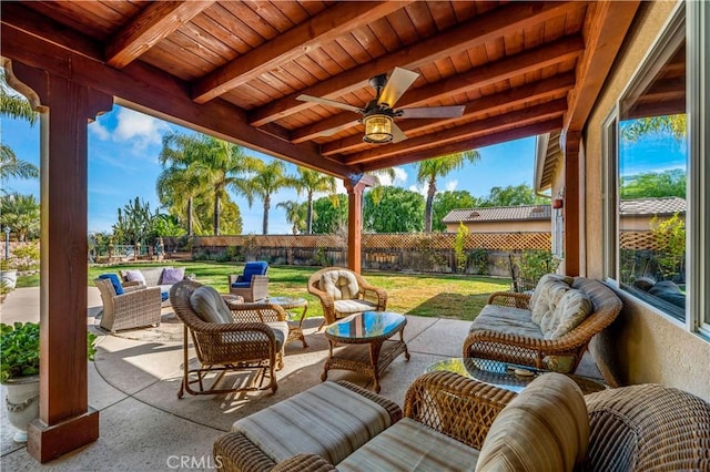 view of patio / terrace with a fenced backyard, an outdoor hangout area, and a ceiling fan