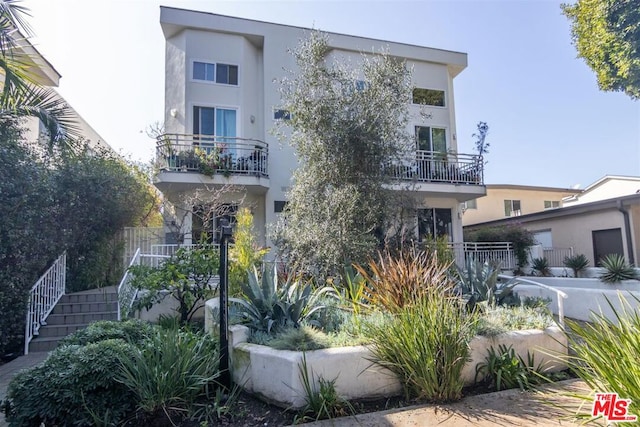 view of front of house with a balcony