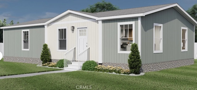 view of front of house with a front yard and entry steps