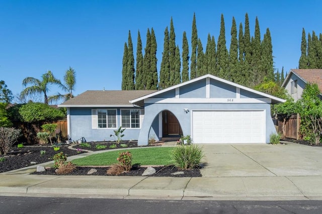 ranch-style house with a garage and a front lawn