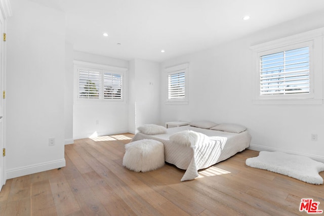 bedroom with light wood-type flooring