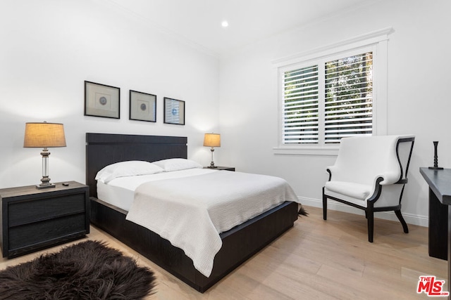 bedroom with light hardwood / wood-style flooring