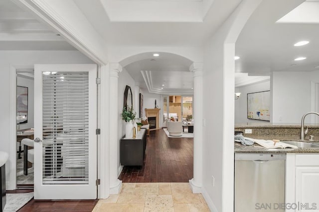 interior space featuring sink and a tray ceiling