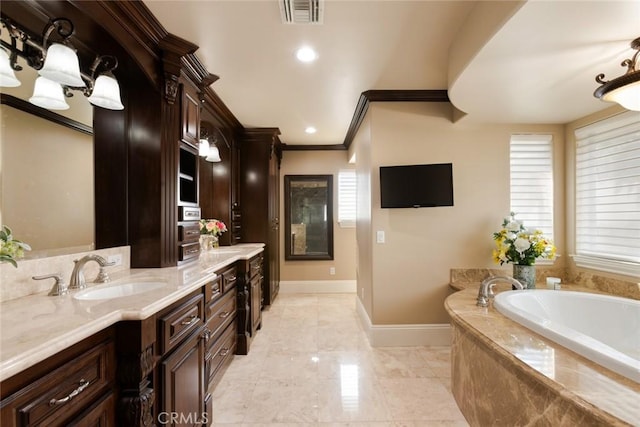 bathroom featuring tiled tub, vanity, and crown molding