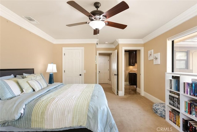 carpeted bedroom with ornamental molding and ceiling fan