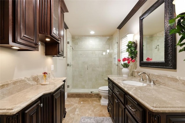 bathroom featuring vanity, toilet, and walk in shower